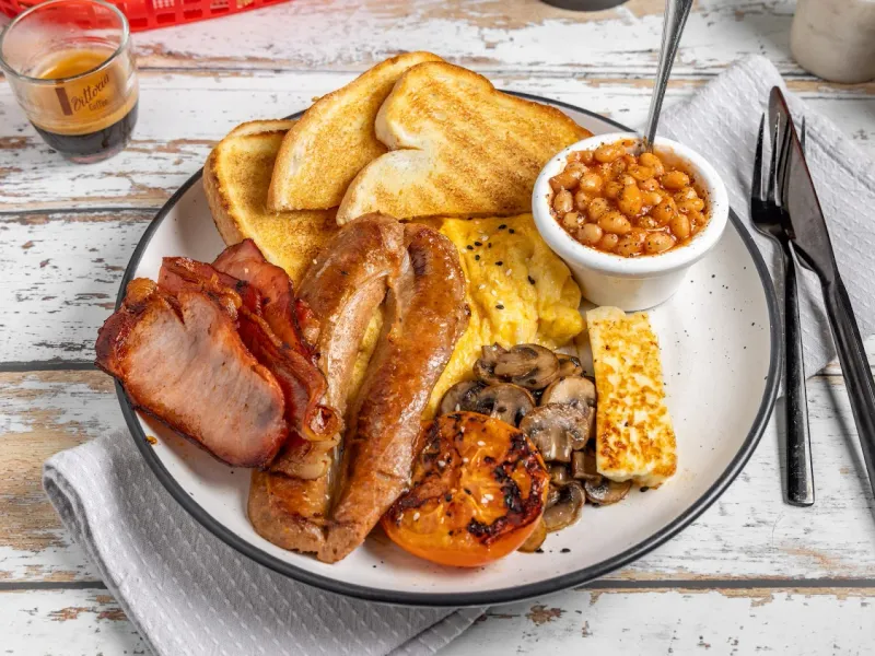 The full Grumpy Dads breakfast — bacon, sausage, eggs, toast, beans, mushrooms, halloumi