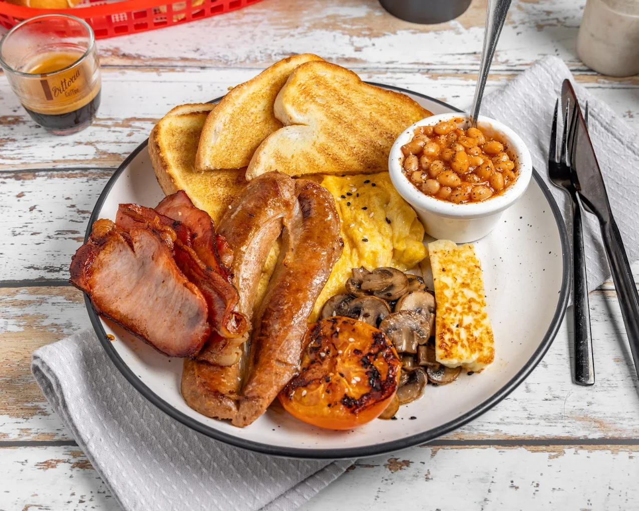 The full Grumpy Dads breakfast — bacon, sausage, eggs, toast, beans, mushrooms, halloumi